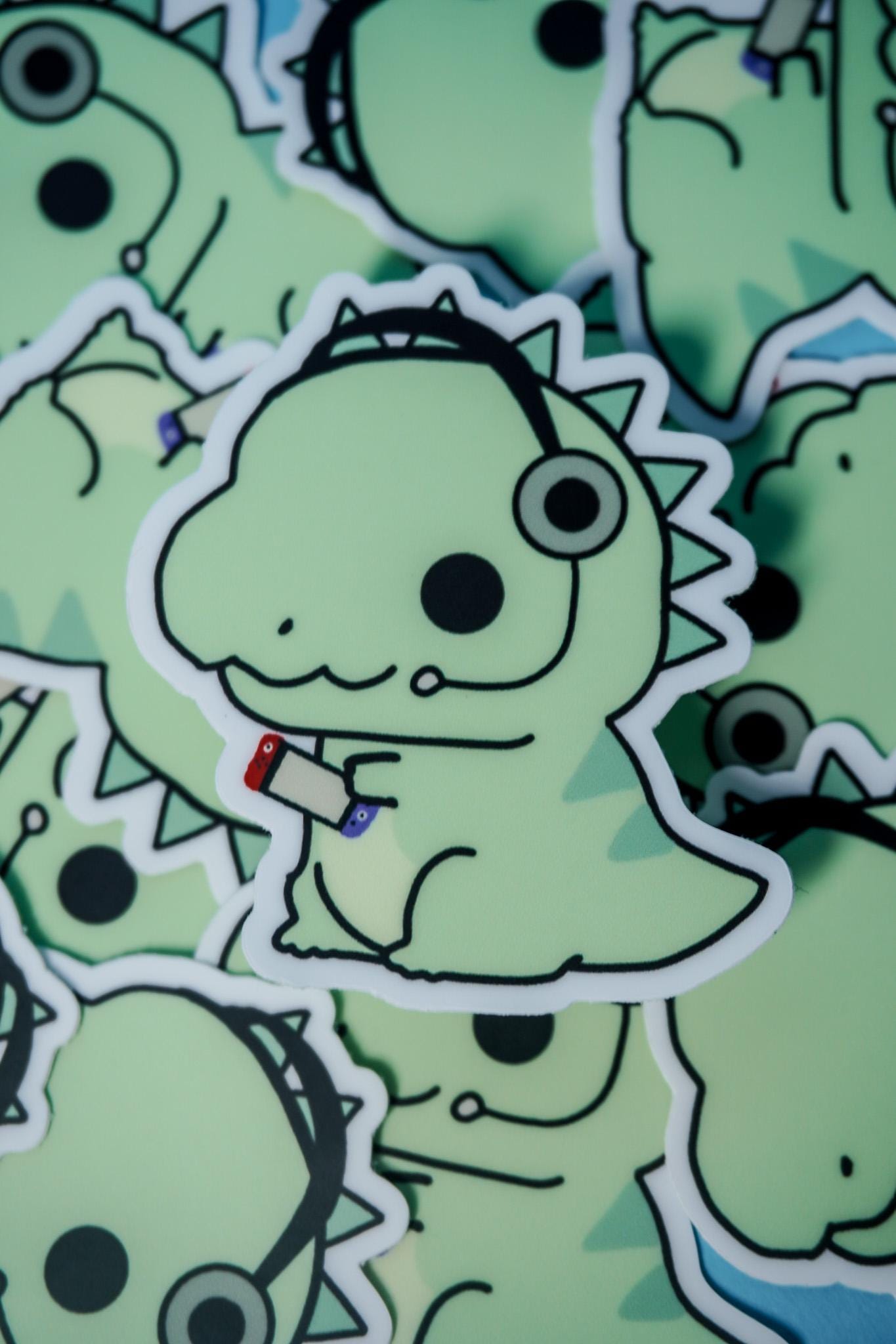 Gamer Dino Sticker | Cute Dinosaur Vinyl Sticker with Headset & Controller | Kawaii Gaming Sticker for Laptop, Water Bottle, Journaling